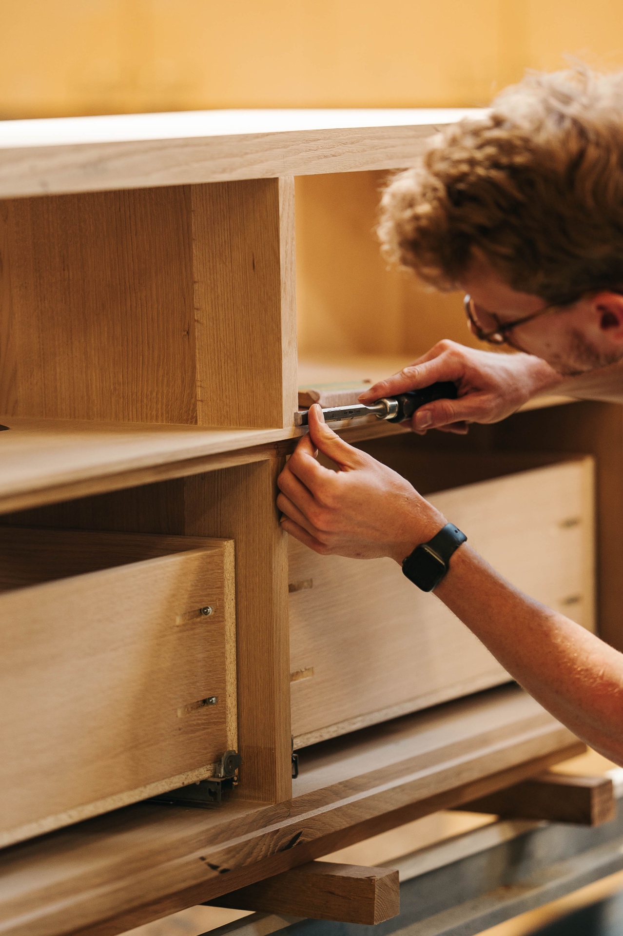 Martin fitting a drawer front by hand